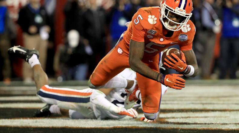 CHARLOTTE, NORTH CAROLINA - DECEMBER 07: Heskin Smith #23 of the Virginia Cavaliers watches as Tee Higgins #5 of the Clemson Tigers catches a touchdown during the ACC Football Championship game at Bank of America Stadium on December 07, 2019 in Charlotte, North Carolina. (Photo by Streeter Lecka/Getty Images)