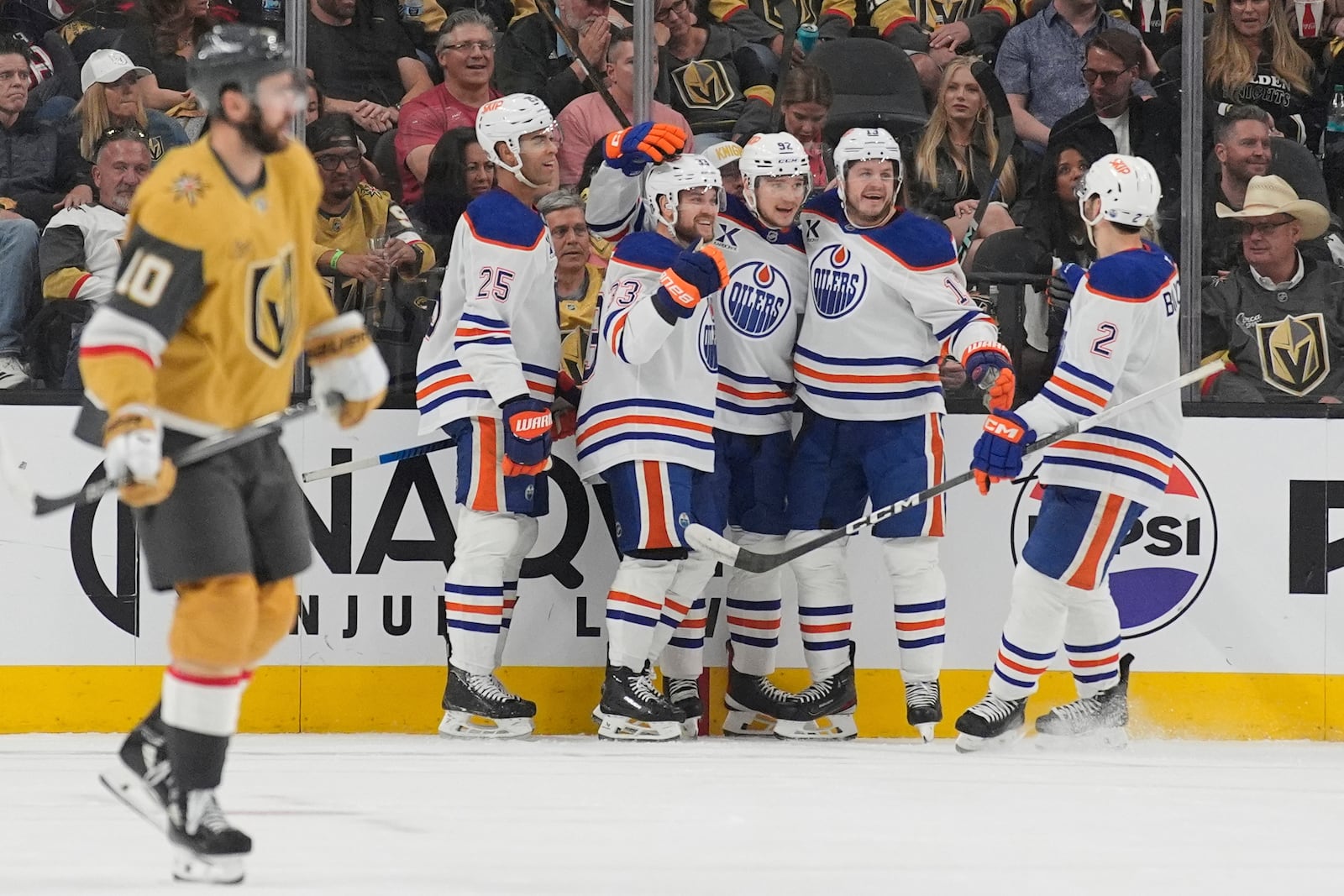 Edmonton Oilers right wing Vasily Podkolzin (92) celebrates with teammates after scoring against the Vegas Golden Knights during the second period of Game 2 of a second-round NHL hockey playoff series Thursday, May 8, 2025, in Las Vegas. (AP Photo/John Locher)