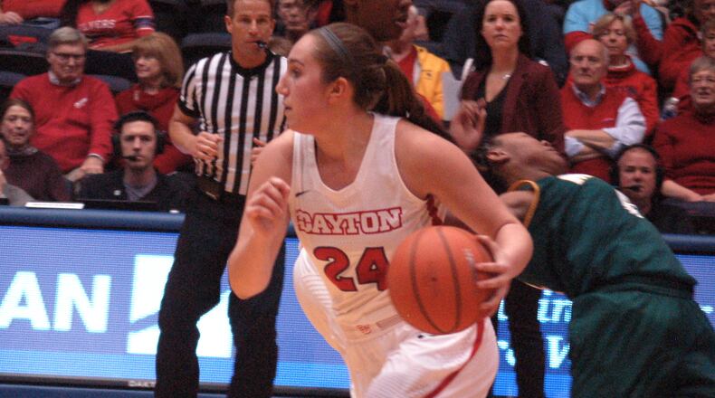 Lauren Cannatelli pushes the ball up the court against George Mason on Wednesday night at UD Arena. John Cummings/CONTRIBUTED