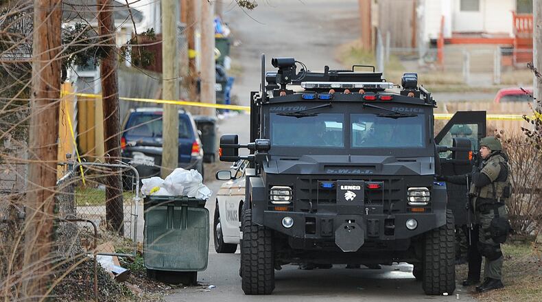 A SWAT standoff on East Third Street in Dayton ended after nearly seven hours with a man being taken into police custody. No injuries were reported during the standoff. MARSHALL GORBY\STAFF