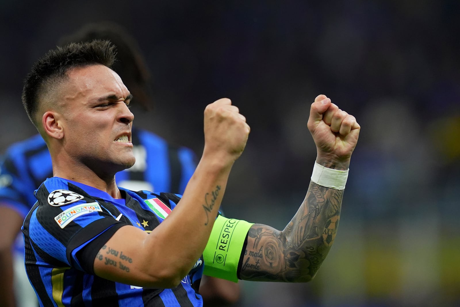 Inter Milan's Lautaro Martinez celebrates after scoring his side's opening goal during the Champions League semifinal second leg soccer match between Inter Milan and Barcelona at San Siro stadium in Milan , Italy, Tuesday, May 6, 2025.. (Spada/LaPresse via AP)