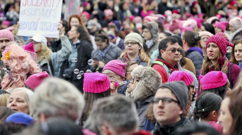 Emily Phonelath blows bubbles while in the crowd of the Women’s March on Washington in Washington D.C. on Saturday, Jan. 21, 2017. ( Aileen Devlin /The Daily Press via AP)