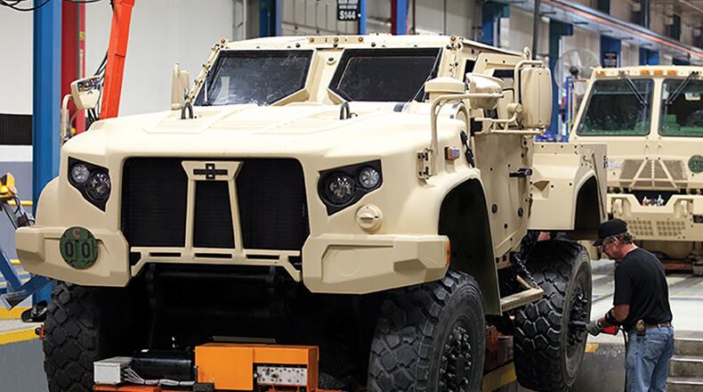 A Joint Light Tactical Vehicle moves on a production line. The new vehicle will begin replacing up-armored High Mobility Multipurpose Wheeled Vehicles, better known as Humvees in 2021. U.S. AIR FORCE PHOTO