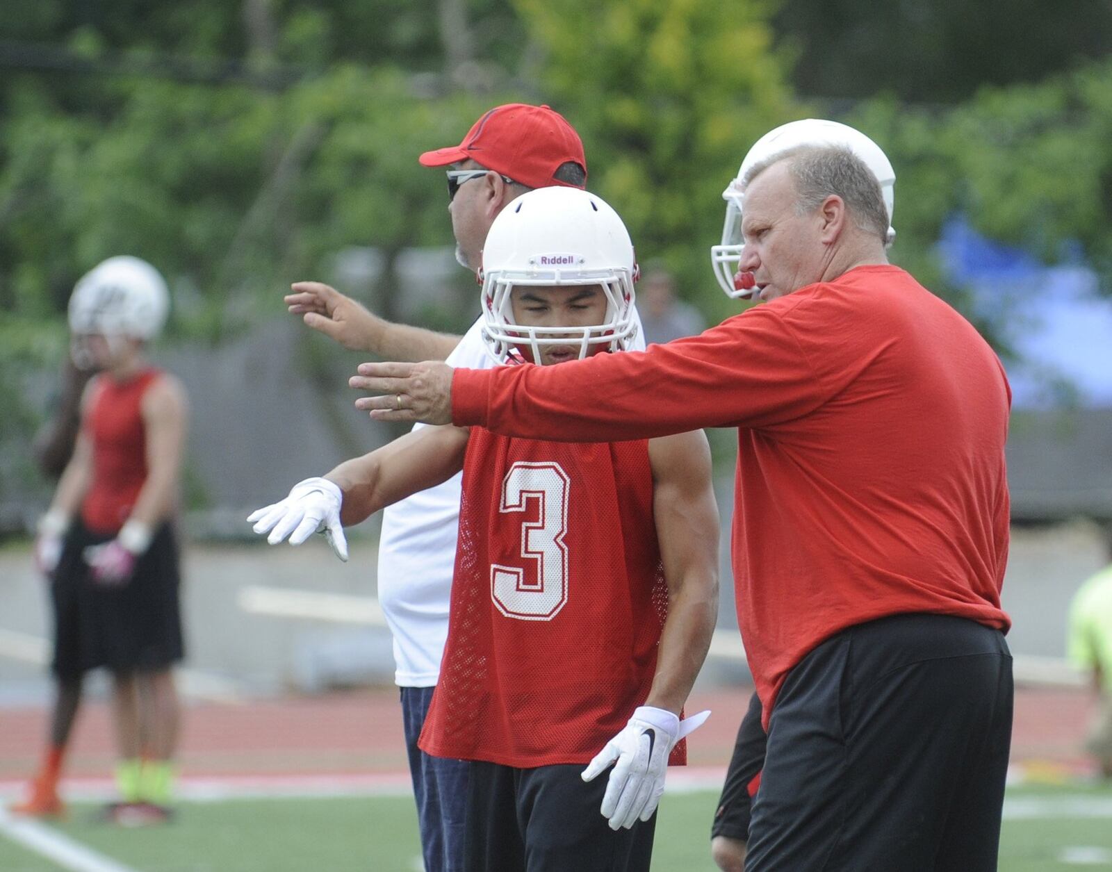 Jay Minton (right) has been Wayne’s head football coach since 1999. MARC PENDLETON / STAFF