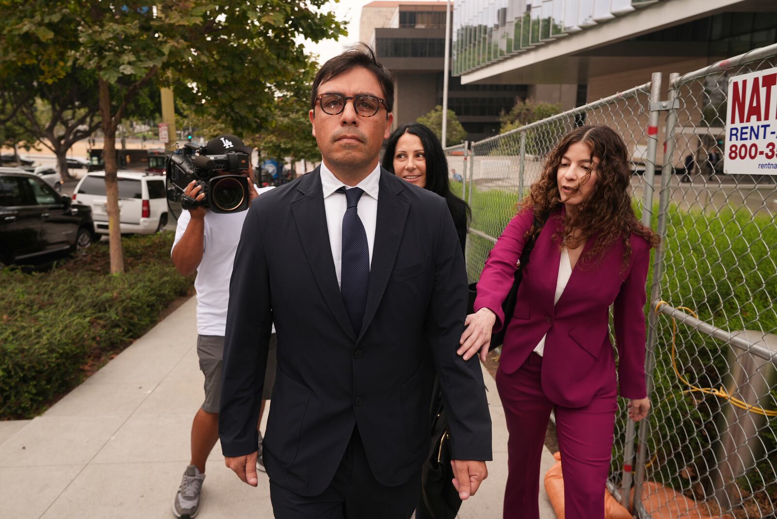 Dr. Salvador Plasencia leaves federal court with his attorneys on Wednesday, July 23, 2025 in Los Angeles, after pleading guilty to giving ketamine to Matthew Perry, leading up to the actor's 2023 overdose death. (AP Photo/Damian Dovarganes)