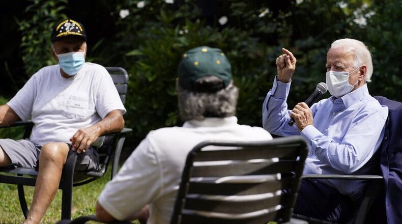 FILE - In this Sept. 7, 2020, file photo Democratic presidential candidate former Vice President Joe Biden speaks during an event with local union members in the backyard of a home in Lancaster, Pa. Campaigns are using different tactics in a pandemic election year unlike any other as candidates try to win over voters in down-ballot races that will determine control of Congress. Democrats, led by Biden, are keeping events small and mostly online. (AP Photo/Carolyn Kaster, File)