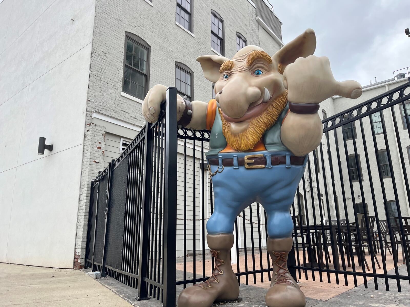 The giant troll welcomes visitors to the Troll Pub at the Wheelhouse at 216 Wayne Ave. near the Oregon District. The Wheelhouse, a former manufacturing facility, was turned into housing and first-floor commercial spaces by Weyland Ventures with the help of state historic tax credits. CORNELIUS FROLIK / STAFF