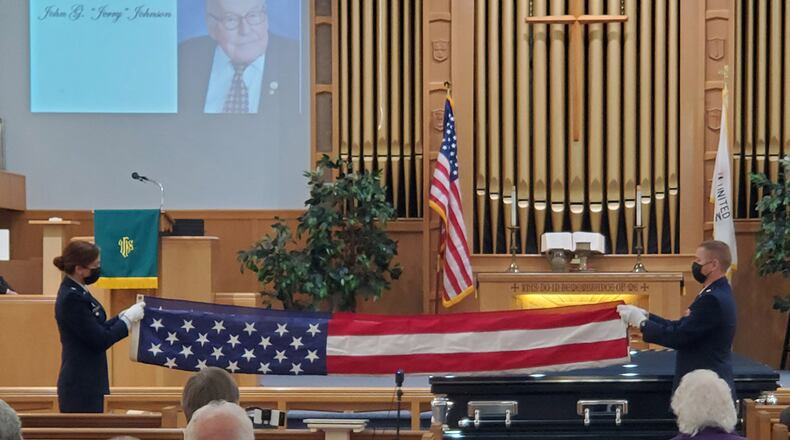 Retired Lt. Col. Dianne Hickey, former 14th Intelligence Squadron commander, and Maj. Andrew Soine, 14 IS director of operations, fold a U.S. flag as part of the military honors conducted during World War II veteran John “Jerry” Johnson’s funeral Oct. 23. Johnson had served in Guam during World War II with the Army Air Corps in the 20th Air Force’s 9th Photographic Technical Squadron, which ultimately became 14 IS. CONTRIBUTED PHOTO