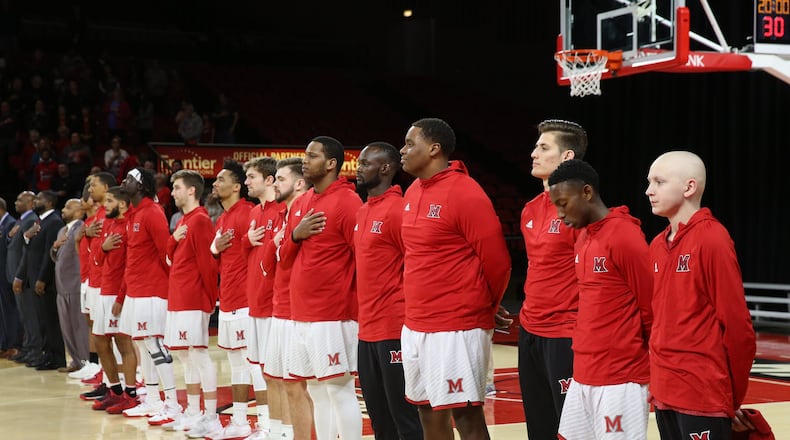 Jackson Hogenkamp stands with Miami’s men’s basketball team for the National Anthem before Saturday’s game against Ball State. CONTRIBUTED