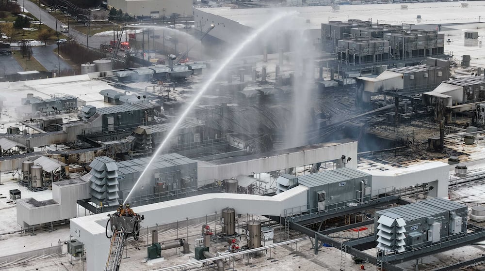 A large industrial fire at Koch Foods Plant B on Commerce Center Drive in Fairfield led to a roof collapse. NICK GRAHAM/STAFF