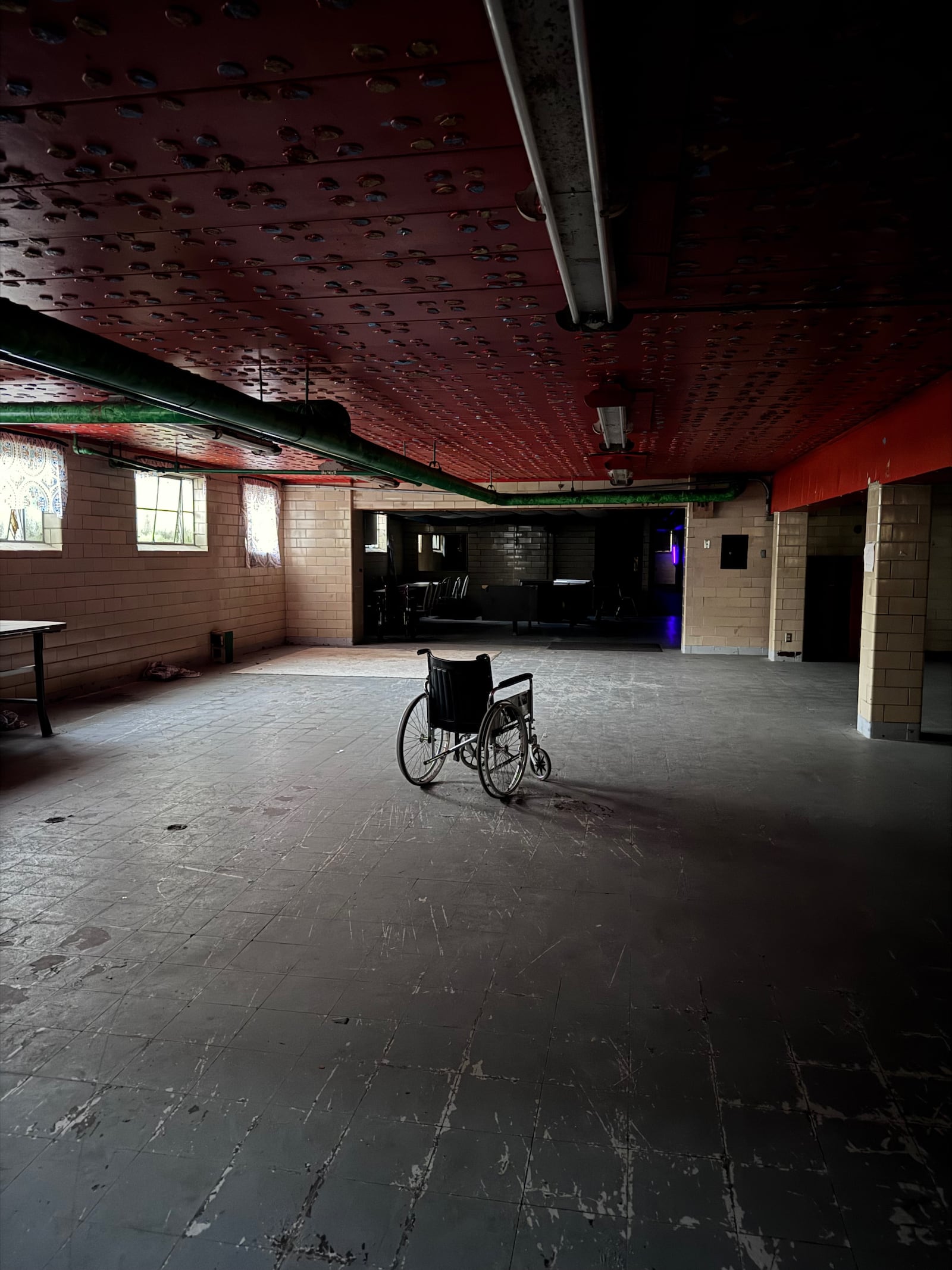 A wheelchair nonchalantly hangs out in the basement cafeteria of Poasttown Elementary School. CONTRIBUTED/ADAIR TUDOR