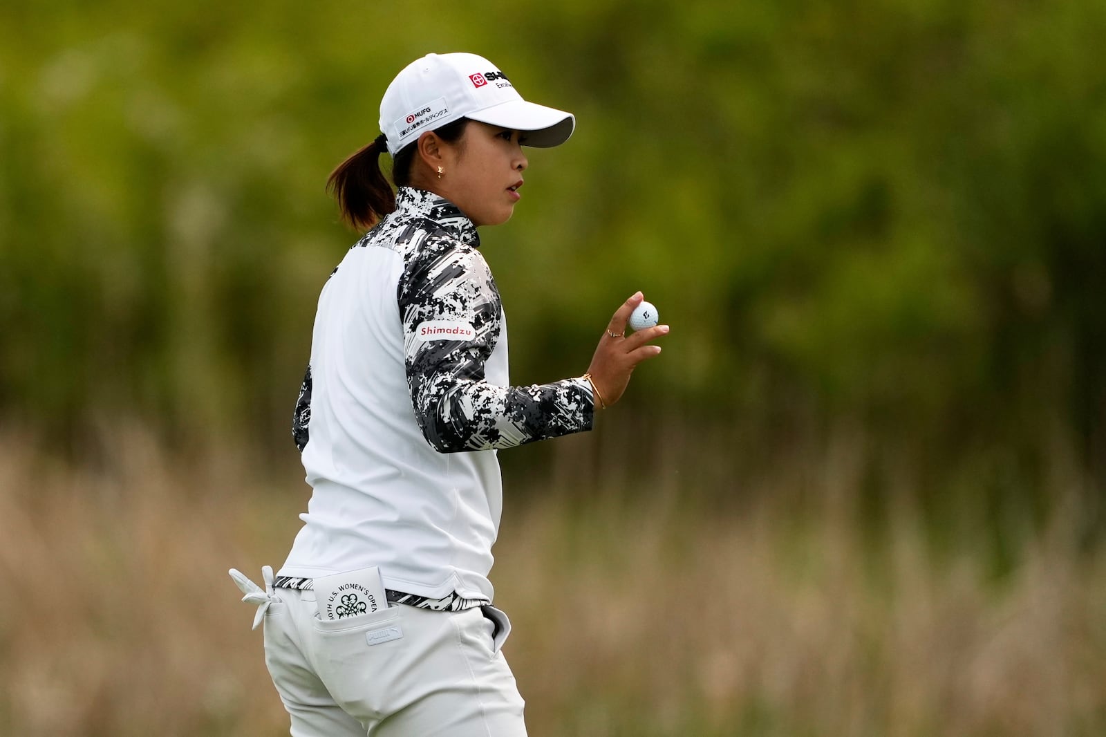Mao Saigo, of Japan, on the first green during the second round of the U.S. Women's Open golf tournament at Erin Hills Friday, May 30, 2025, in Erin, Wis. (AP Photo/Matt York)