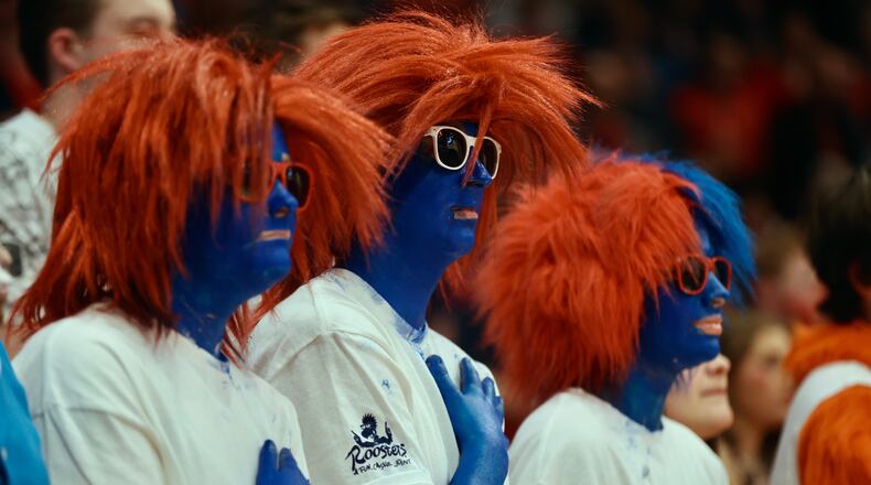 Dayton fans in the Red Scare student section stand for the national anthem before a game against Duquesne on Tuesday, Feb. 13, 2024, at UD Arena. David Jablonski/Staff