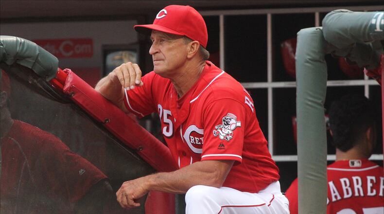 Reds bench coach Jim Riggleman watches from the dugout during a game against the Marlins on Thursday, Aug. 18, 2016, at Great American Ball Park in Cincinnati. David Jablonski/Staff