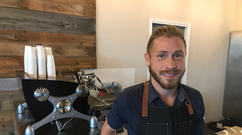 Nathan Wirrig, business owner and barista at La Gota, opened the new coffee shop today at 804 E. Monument Ave. in downtown Dayton.