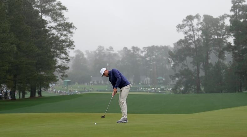 Amateur, Austin Greaser putts on the first green during the first round at the Masters golf tournament on Thursday, April 7, 2022, in Augusta, Ga. (AP Photo/Jae C. Hong)