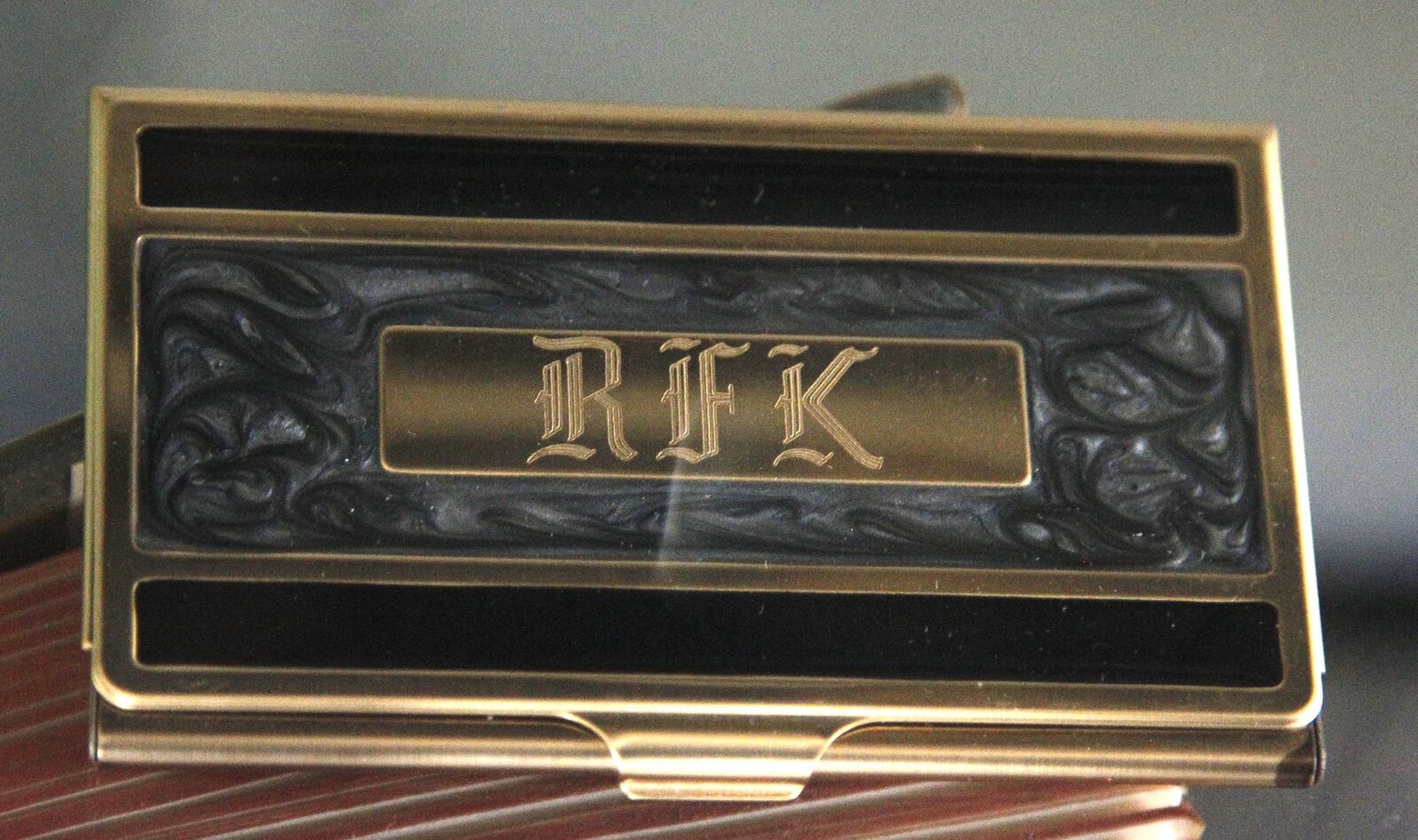 An engraved business card holder with the initials RFK, used by Robert F. Kennedy during his brother’s 1960 presidential campaign, was purchased by Bill White of Dayton at auction in the 1990s. LISA POWELL / STAFF