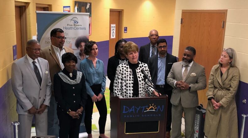 Officials from Dayton Public Schools, the Five Rivers Health Centers and the city of Dayton announced plans for an in-school health clinic last spring. JEREMY P. KELLEY / STAFF