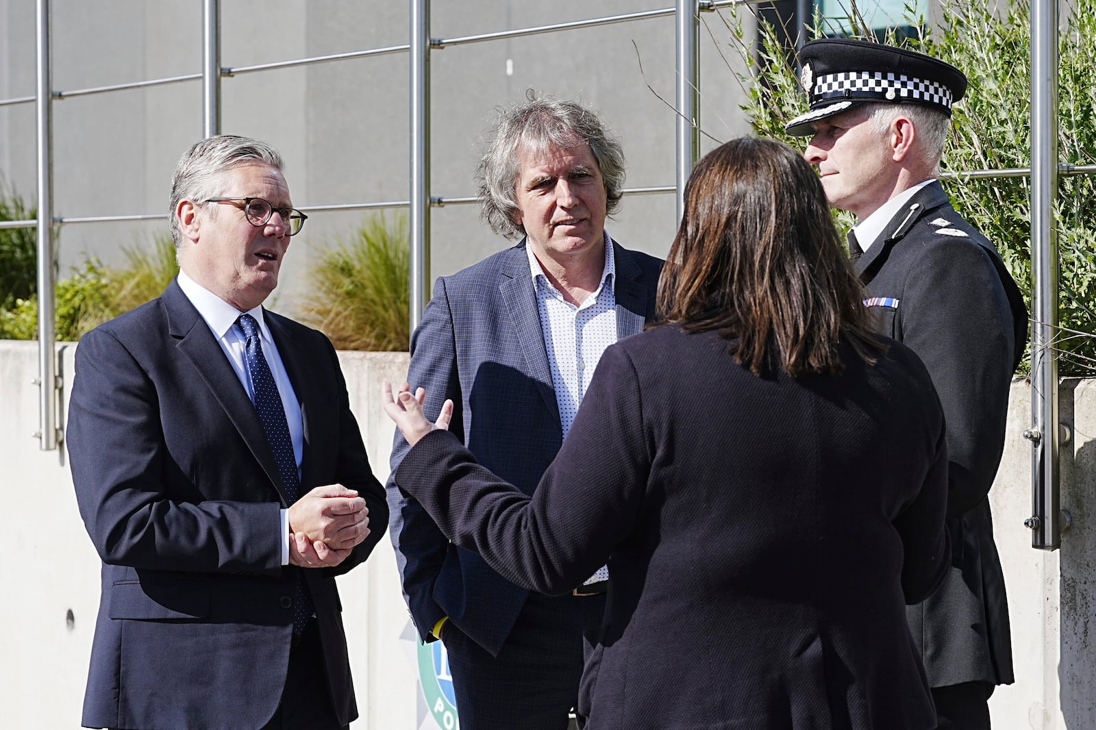 Britain's Prime Minister Keir Starmer, left, meets with Police and Crime Commissioner Emily Spurrell, second right, Deputy Chief Constable Chris Green, right, and the Mayor of Liverpool City Region, Steve Rotheram at Merseyside Police Headquarters, in Liverpool, England, Wednesday, May 28, 2025. (Peter Byrne/Pool photo via AP)