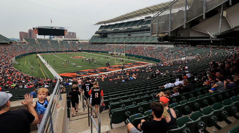 Fans watch as the Cincinnati Bengals participate in drills during an NFL football practice in Cincinnati, Saturday, July 31, 2021. (AP Photo/Aaron Doster)