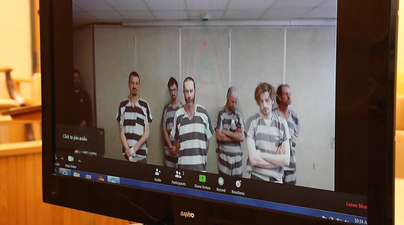 Steven Toms, center, appears Monday with other Clark County Jail inmates for their video arraignment, which is being used in Clark County Municipal Court in response to the coronavirus pandemic. BILL LACKEY/STAFF