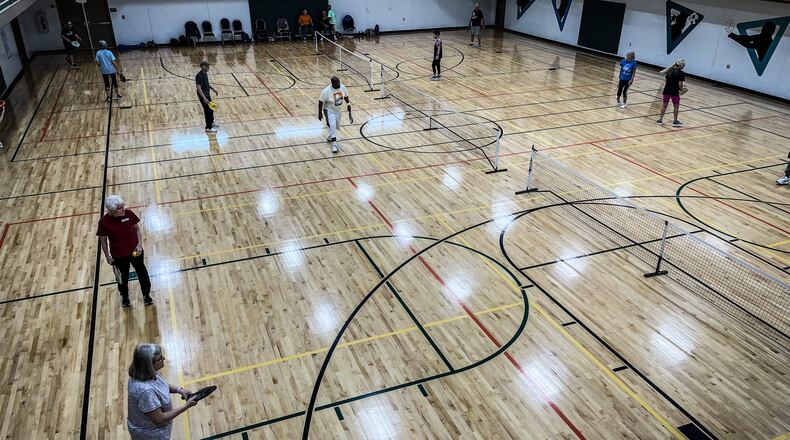 Lots of seniors play pickle ball at the YMCA in Englewood on National Rd. JIM NOELKER/STAFF