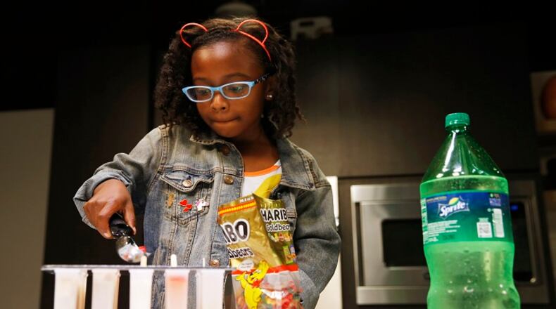 Ellington Young, 7, makes a gummy bear and lemon lime soda popsicle in the studio in Dallas on Friday, June 7, 2018. (Vernon Bryant/The Dallas Morning News/TNS)