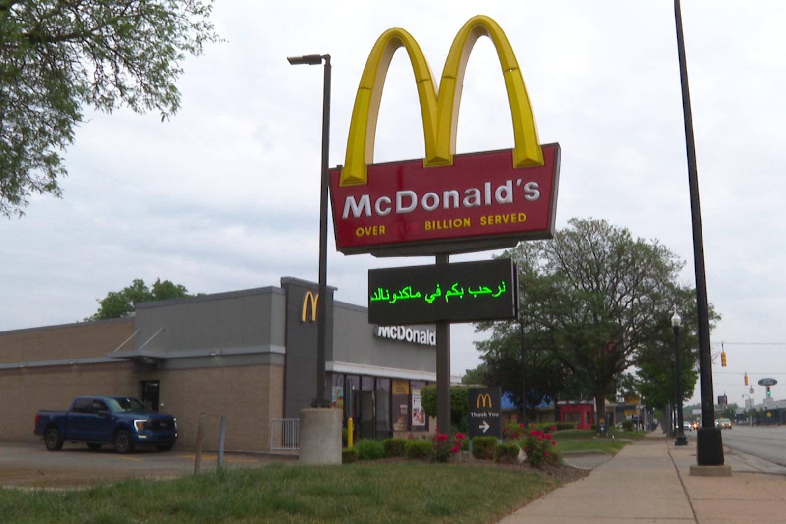 In this image made from video, a McDonald's restaurant's digital board features a message in Arabic Monday, June 9, 2025, in Dearborn, Mich. (AP Photo/Mike Householder)