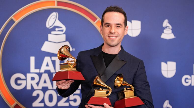 FILE - Edgar Barrera, winner of the awards for best tropical song and song of the year for "Si Antes Te Hubiera Conocido," and award for songwriter of the year, poses in the press room during the 2025 Latin Grammys in Las Vegas on Nov. 13, 2025. (AP Photo/John Locher, File)