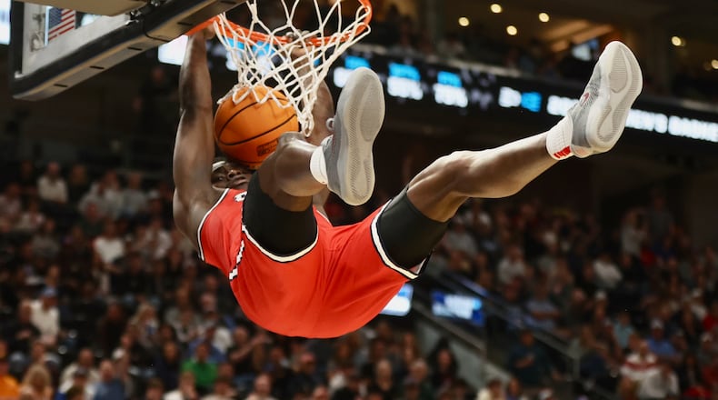 Dayton's Enoch Cheeks dunks against Arizona in the second round of the NCAA tournament on Saturday, March 23, 2024, at the Delta Center in Salt Lake City, Utah. David Jablonski/Staff