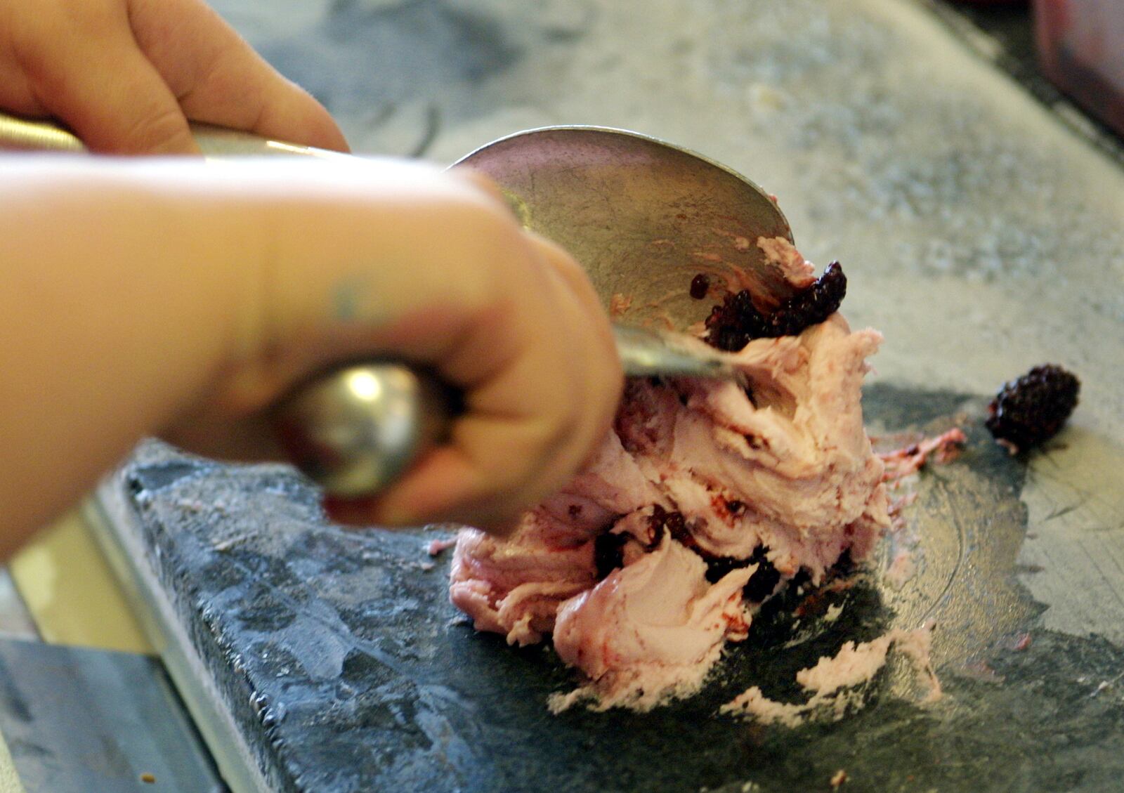 At Cold Stone Creamery 45 different treats, such as candy and fruits, can be mixed into ice cream. The concoctions are mixed on an ice cold granite counter.