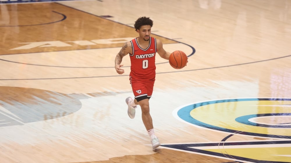 Dayton's Javon Bennett dribbles against George Washington on Friday, Feb. 27, 2026, at the Charles E. Smith Center in Washington, D.C. David Jablonski/Staff