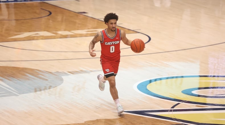 Dayton's Javon Bennett dribbles against George Washington on Friday, Feb. 27, 2026, at the Charles E. Smith Center in Washington, D.C. David Jablonski/Staff