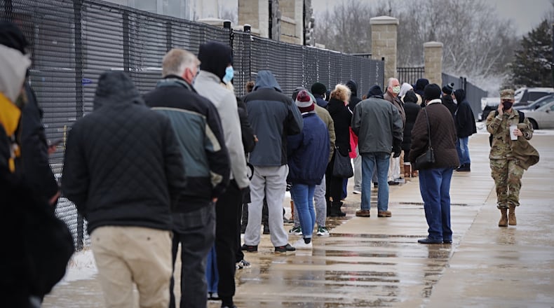 People wait in line at the Montgomery County Fairgrounds for free coronavirus testing on Tuesday, Dec. 1, 2020. STAFF/MARSHALL GORBY