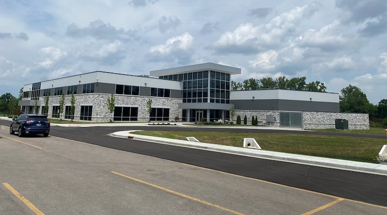 CRG Defense held a ribbon-cutting ceremony for its new 25,763-square-foot headquarters at 8789 Washington Church Road in Miami Twp. on Tuesday, July 15. The two-story facility includes 19,673 square feet of office space and 6,090 square feet of community space, designed to support collaboration and innovation. ERIC SCHWARTZBERG/STAFF