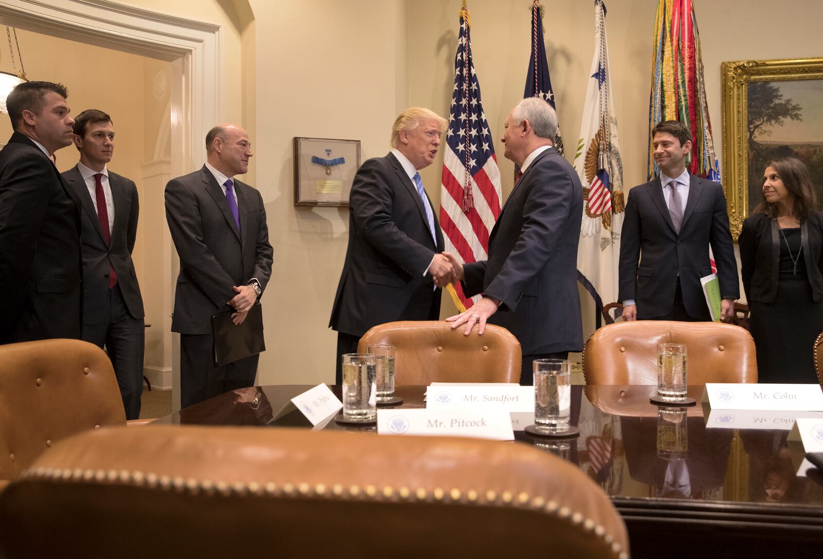 President Donald Trump greets Greg Sandfort, chief executive of Tractor Supply Co., during a meeting with the Retail Industry Leaders Association and member company chief executives in the Roosevelt Room of the White House, in Washington earlier this month. Business leaders are confident President Trump is steering the economy in the right direction, based on the results of a new survey. Stephen Crowley/The New York Times