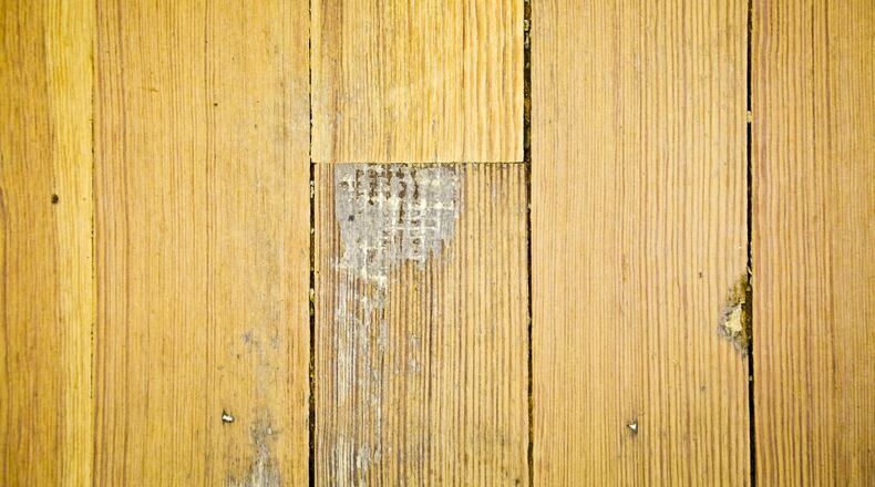 The original hardwood floors from 1889 were recently discovered on the second floor of the historic Butler County Courthouse. Work is now underway to restore them. GREG LYNCH / STAFF