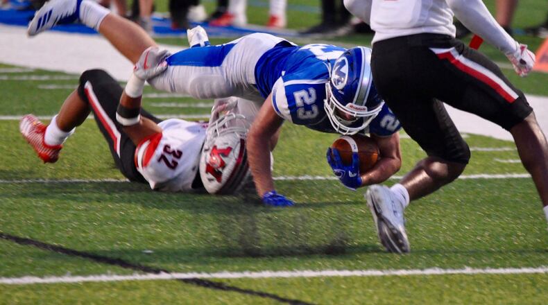 Miamisburg running back Jon Yerkins fights for extra yardage during the Vikings’ home game against Wayne Friday, Sept. 18, 2018. Nick Dudukovich/CONTRIBUTED