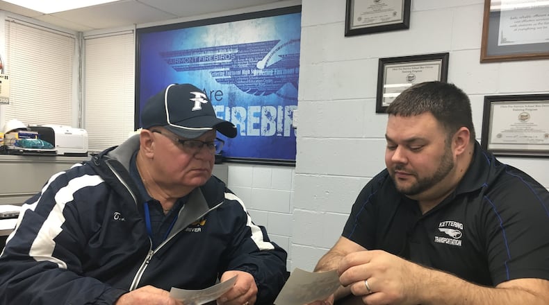 Bus driver Terry Lloyd, left, this month celebrated his 50th anniversary as a bus driver for Kettering City Schools. He’s pictured with Transportation Supervisor, Todd Silverthorn. STAFF