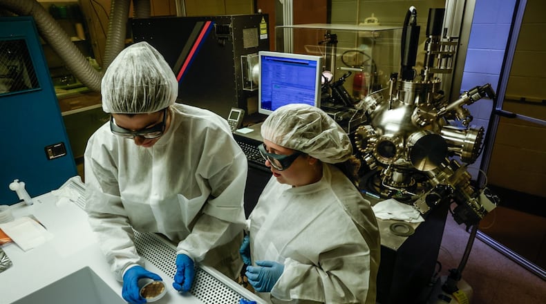 University of Dayton electrical engineering student Malia Hoffmire, left, and UD OASIS program participant Leah Dalton work in the Kettering Lab on the UD campus Monday April 22, 2024. The two women are making semiconductors. JIM NOELKER/STAFF