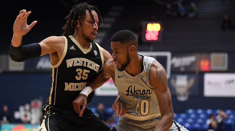 Akron’s Xeyrius Williams drives against Western Michigan’s Brandon Johnson during a game earlier this season. Akron University photo