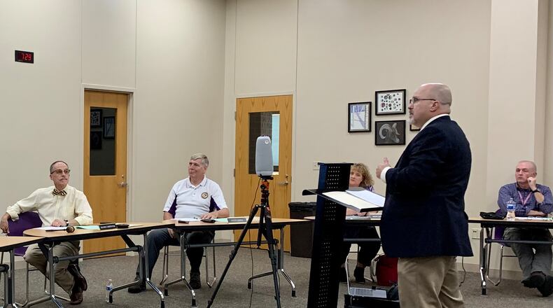 Detective Sgt. Lon Etchison addresses the Bellbrook-Sugarcreek school board on Sept. 8. LONDON BISHOP/STAFF