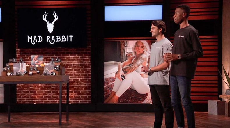 Recent Miami University graduates Oliver Zak (left) and Selom Agbitor impressed in their high-pressure debut last year on ABC's nationally televised show "Shark Tank." The pair, which created the Mad Rabbit skin care company, got investor Mark Cuban to pony up $500,000 for their start up firm. The two, who just signed a national distribution deal, are shown on stage during the broadcast. (Provided Photo\Journal-News)