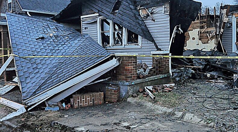 A George Street home in Dayton exploded after a man attempted to relight the furnace's pilot light. STAFF PHOTO / MARSHALL GORBY