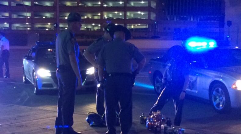 Police and state troopers recovered a large amount of alcohol and cigarettes after a multi-county pursuit on I-75 that ended in Dayton. (Desmond Winton-Finklea/Staff)