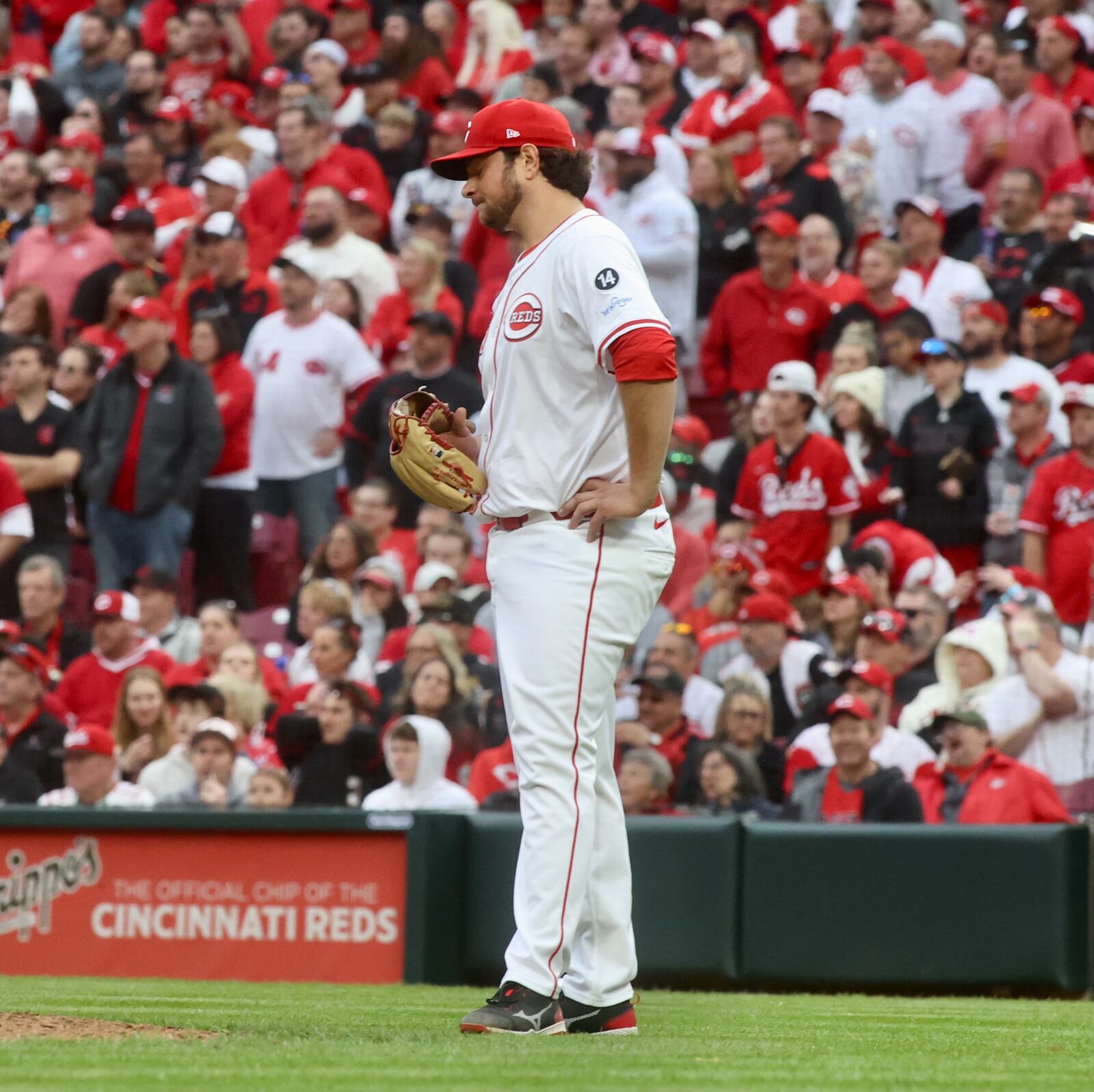Reds reliever Ian Gibaut reacts after giving up a tie-breaking, three-run home run to Wilmer Flores, of the Giants, in the ninth inning on Thursday, March 27, 2025, before an Opening Day at Great American Ball Park in Cincinnati. David Jablonski/Staff
