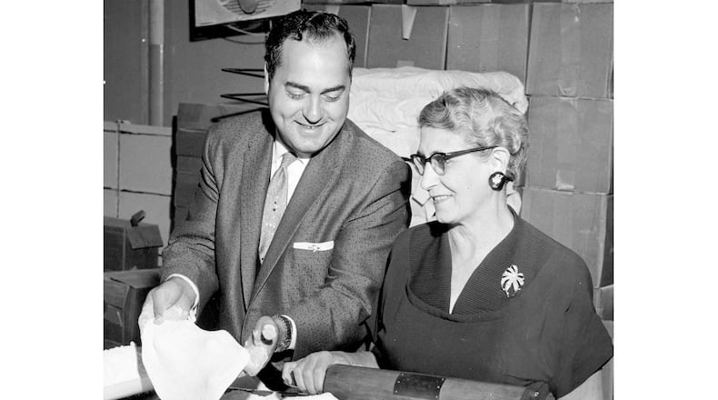 The original caption dated July 7, 1964 reads: "Marking their 11th anniversary this month are the Vic Cassano-Mom Donisi Pizza houses which have grown from a one-store operation to a $3 million a year business. Above, Cassano and Mrs. John (Mom) Donisi, his mother-in-law, are shown in the central commissary from which ingredients are distributed to their pizza outlets." DAYTON DAILY NEWS ARCHIVE