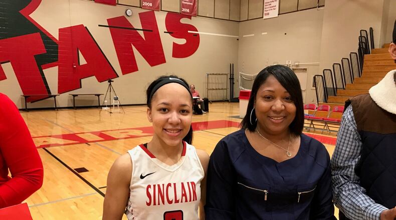 Nia Martin with mom Monique after Sinclair’s game on Saturday. Tom Archdeacon/STAFF
