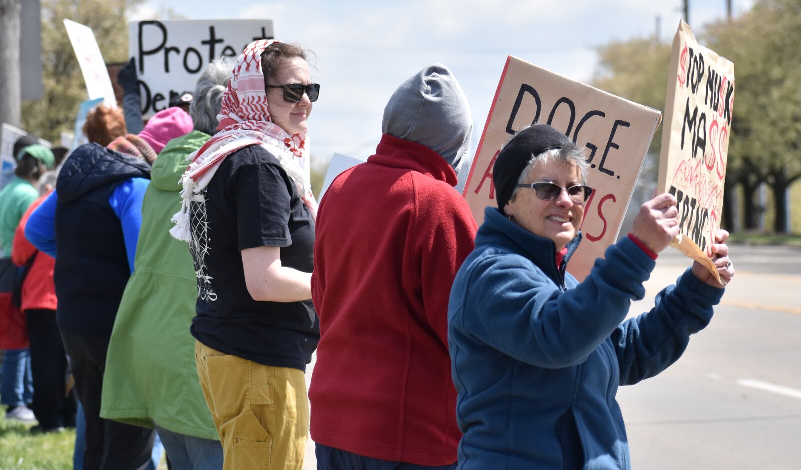 Anti-Musk protests continued on Saturday, April 12, 2025, at a Tesla facility in Moraine. People are the protest said veterans, Social Security, Medicare, Medicaid and other social services were at the top of their concerns. SAM WILDOW/STAFF