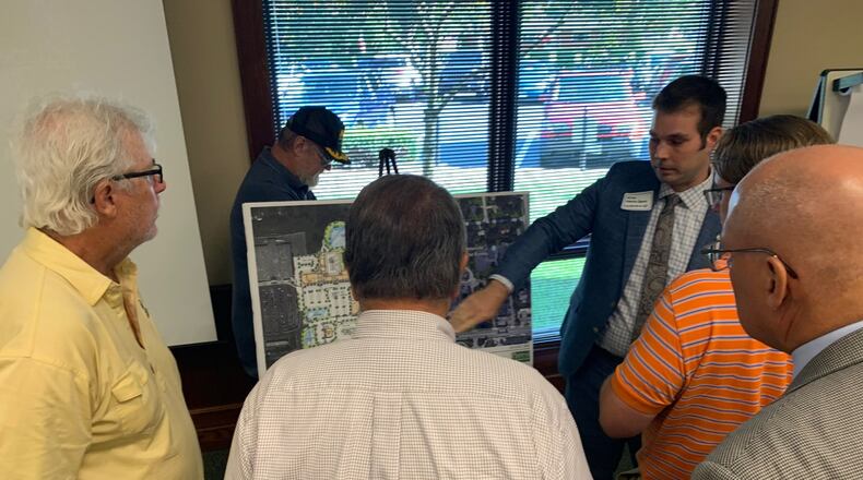 An open house was held Thursday night to discuss a well-known local developer’s $146 million plan called Centerville Place that city officials say will bring new energy to the city and help invigorate its economy. Economic Development Administrator Michael Norton-Smith meets with residents. STAFF